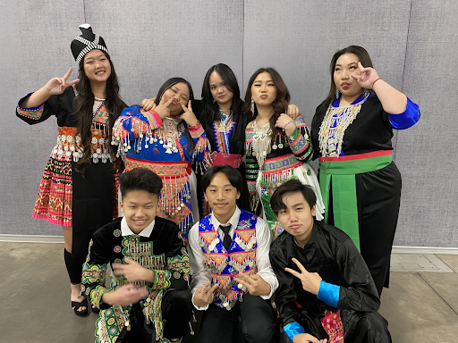 ITA students, Samantha (top middle) and Owen (bottom right) pictured with their friends at the Madison Hmong New Year celebration.
